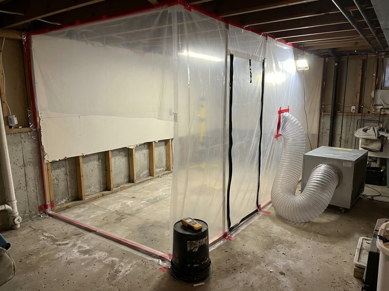 Plastic containment and air scrubber set up for mold removal